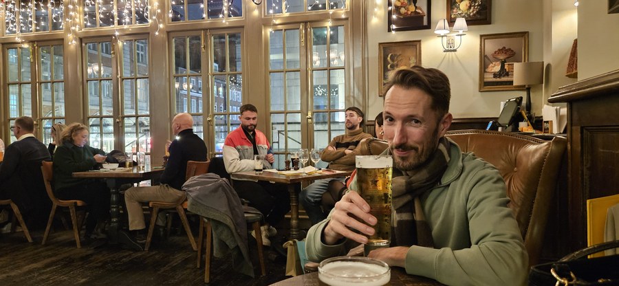 Adam having a beer at the pub